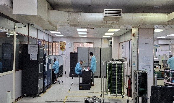 "Students observing advanced machinery at ELCIA Cluster prototyping